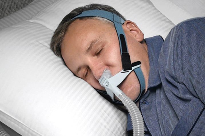 Man wearing CPAP machine