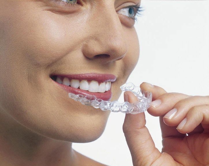 Woman using invisalign