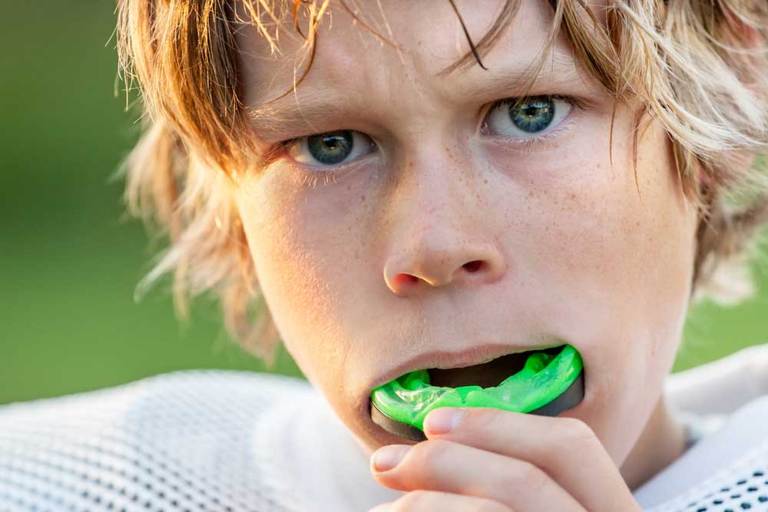 Boy using mouth guard